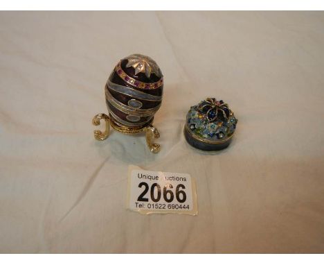 A Faberge' style enamel egg pill box and another enamel pill box.