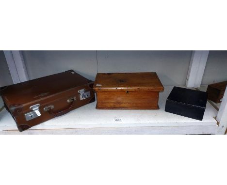 A small vintage suitcase and two wooden boxes 