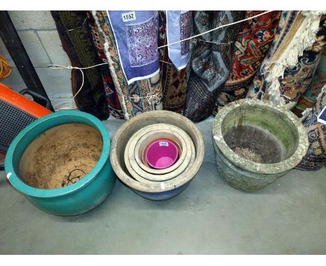 Four graduated blue planters, large green planter and concrete planter. COLLECT ONLY.