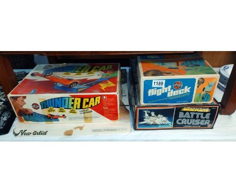 Four vintage Airfix games including flight deck, battle cruiser, Thunder car and other