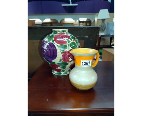 An art deco Shelley jug, burnt orange with a Wade Harvest vase.