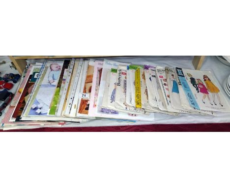 A quantity of vintage knitting and sewing patterns 