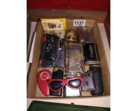 A collection of vintage cigarette lighters. 