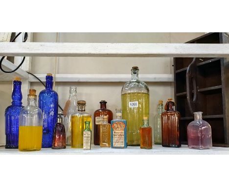 A quantity of old bottles/ medicine bottles and a butler tray.