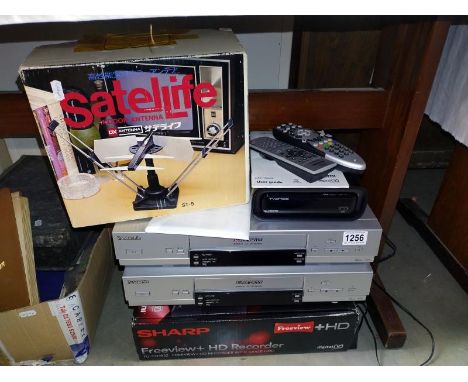 A vintage VHS video recorder etc