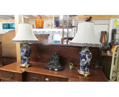 A pair of ceramic table lamps on metal bases complete with shades, 69cm.&nbsp; COLLECT ONLY.