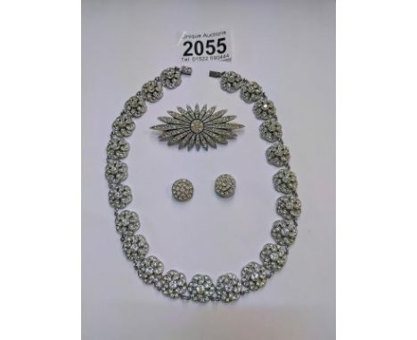 A vintage paste necklace, brooch and ear clips 