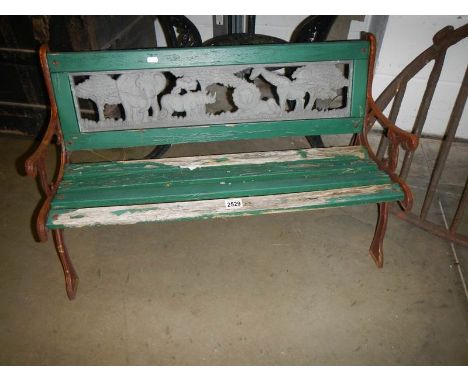 A child's garden bench with cast iron sides and back panel, COLLECT ONLY.
