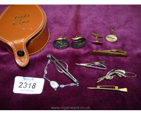 A Links box and contents including a pair of rolled gold cuff links, nail style stick pin, four tie pins including fishing an