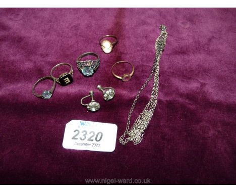 Three silver rings, a pair of clip on ear -rings, small gold ring and a cameo ring.