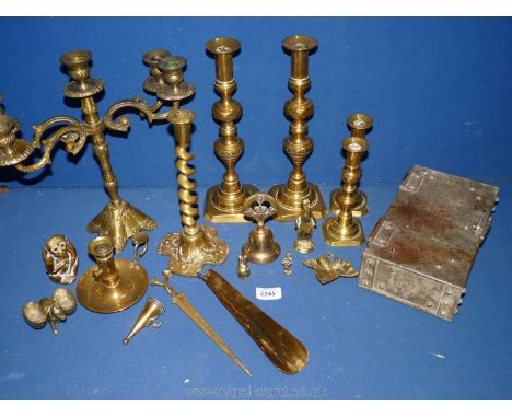 A quantity of brass including candlesticks with pushers, candelabra, wise monkey, chamber stick etc.