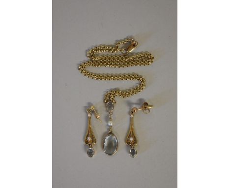 An aquamarine and pearl gold pendant and matching pendant drop earrings. 