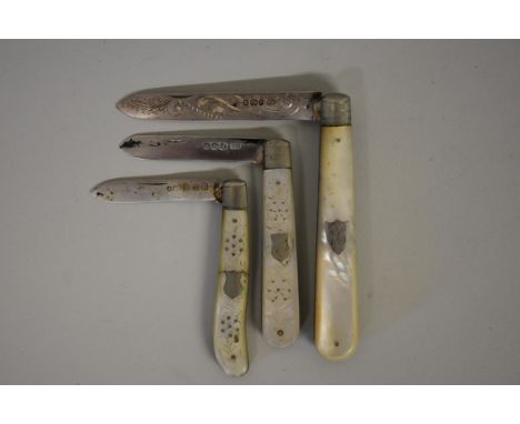 Three silver bladed mother of pearl handled fruit knives. 