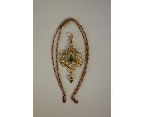 An Edwardian peridot and pearl gold pendant, stamped 15ct; together with an associated metal chain. 
