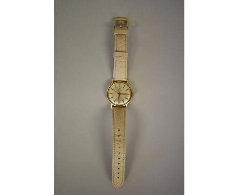 A vintage Zenith yellow metal manual wristwatch, on later cream leather strap. 