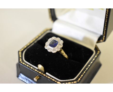 A cushion cut sapphire and rub over diamond gold ring, unmarked. 