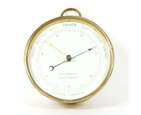 A gilt metal barometer, by D McGregor &amp; Co, Glasgow and Greenock, 13.5cm diameterProvenance:  The Tim Wonnacott Collectio