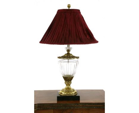 A Christopher Hyde baluster form glass and gilt brass table lamp, with foliate decoration on a black marble base