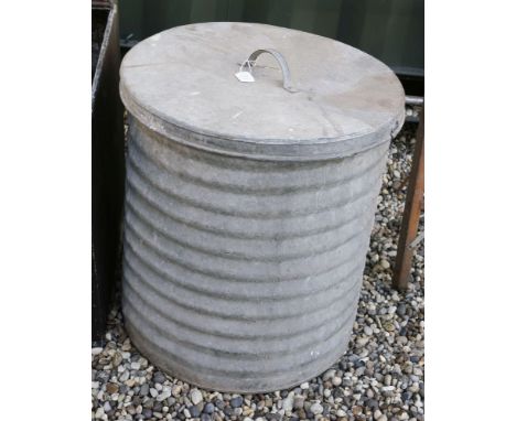 A vintage galvanised ribbed cylindrical bin and cover, 58cm diameter, 68cm high