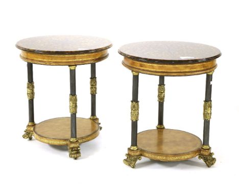 A pair of Neoclassical style two tier circular side tables, by Maitland-Smith, the glass tops with reverse painted compass ro