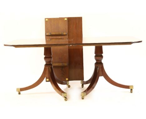 A reproduction mahogany dining suite, by Hale and Redmond comprising a twin pedestal dining table with two leaves, 319cm long