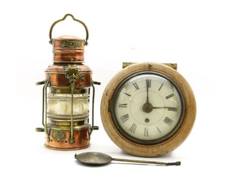 A copper and brass ships lantern and a postman’s clock