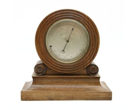 A rosewood cased aneroid mantle barometer and thermometer, c. 1820, 11.5cm diameter, silvered dial, 23cm tall overall