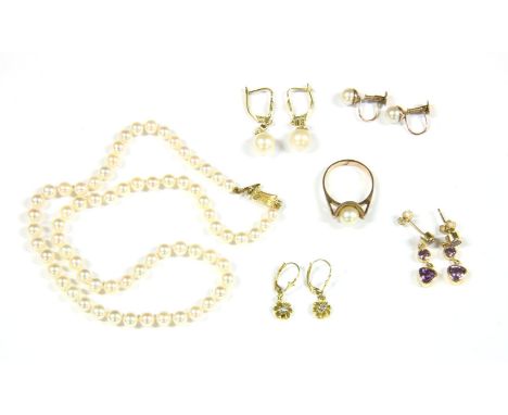 A single row uniform cultured pearls, strung knotted to a gold clasp, marked 14, in original case, a single stone cultured pe