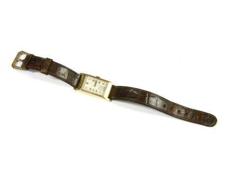 A gentlemen's Art Deco gold mechanical strap watch, rectangular dial, white enamel dial and Arabic numerals with subsidiary s