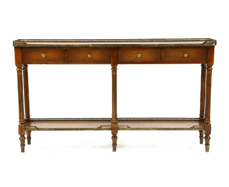 A Regency style two tier console table, by Maitland-Smith, leather lined with a brass three quarter gallery over four frieze 