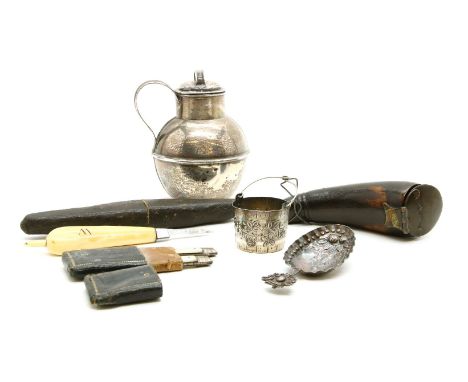 A novelty horn snuff mull, in the form of a seal, a cased folding knife and fork set, a a Dutch silver caddy spoon, bears Dut