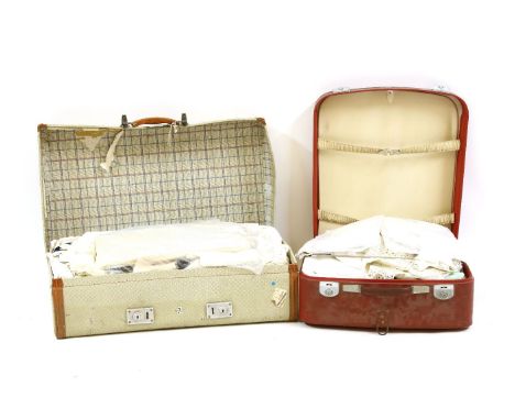 Two vintage Revelation suitcases, both containing a quantity of linen