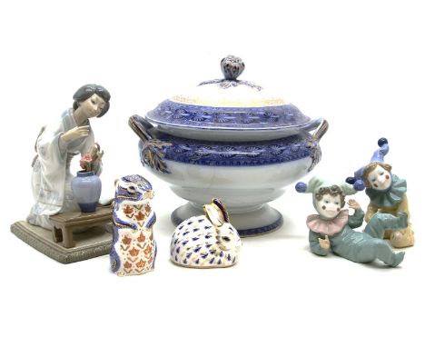 A collection of decorative pottery and porcelain, including Lladro Japanese figures, Royal Crown Derby paperweights, a Poole 