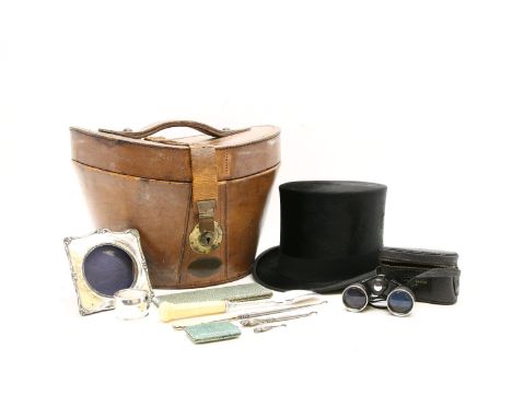 A Tress and Co top hat and original box, together with a silver photograph frame, owl form button hooks, a napkin ring, shagr