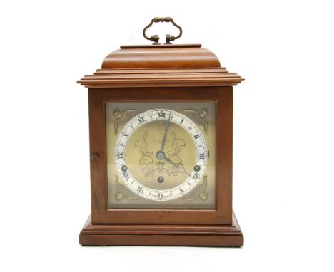 A Garrard walnut cased bracket clock, the brass dial with silvered chapter ring and eight day gong strike movement, 31cm high