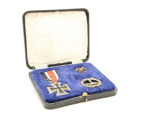 A German submariners medal and badge group, comprising of an iron cross, an imperial German and U-Boat veterans enamel lapel 