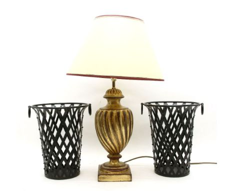 A gilt table lamp, with wrythen moulding on square feet, with shade, and a pair of metal strapwork baskets (4)