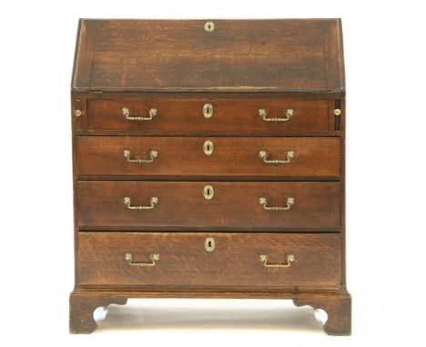 A George III oak fall front bureau, with four graduated drawers, on bracket feet, 92cm wide, 50cm deep, 106cm high