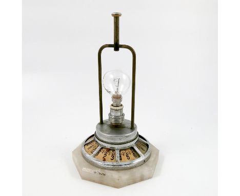 A Le Coultre combination clock table lamp, the central bulb mounted on a dial in chrome plated case, on an octagonal marble b