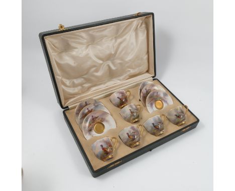 A cased set of Royal Worcester coffee cups and saucers, decorated with pheasants by James Stinton, one saucer damaged, one ba