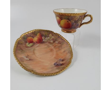 A Royal Worcester tea cup and saucer, decorated with fruit by Love, circa 1955 Condition report: Good condition