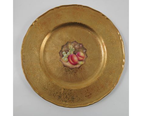 A Royal Worcester acid gilt plate, decorated with grapes and peaches to the centre by Leaman, diameter 10.75ins Condition rep