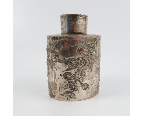 A silver tea caddy, of oval form, embossed with flowers, having a pull off cover, London 1902, weight 3oz Condition report: V