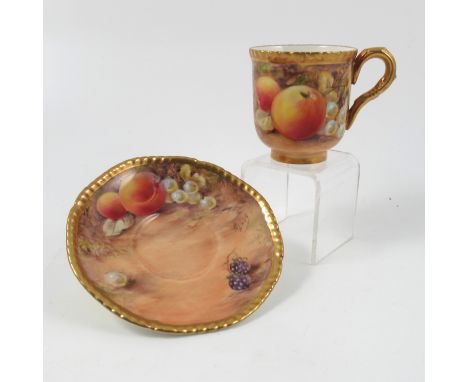 A Royal Worcester coffee cup and saucer, decorated with fruit by Love, circa 1954/5 Condition report: Very minor scratch to c