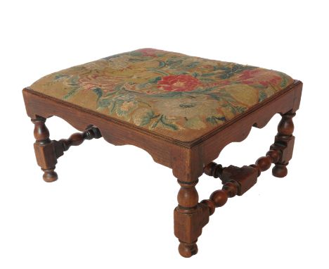 A small low rectangular stool, raised on turned legs in the 17th century style, width 22ins, depth 19ins, height 13ins Condit