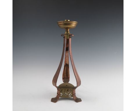 An Arts and Crafts copper and brass table lamp, not stamped but possibly Birmingham Guild of Handicraft, the brass drip tray 