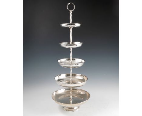 A silver plated graduated cake stand, with ring handle to the top over five circular graduated dishes, raised on a circular f