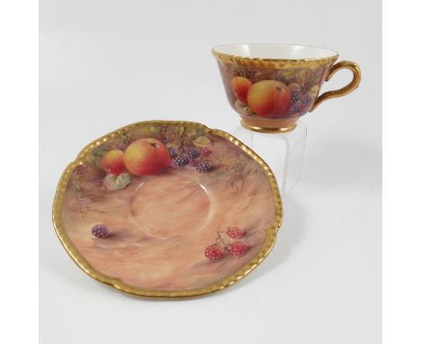 A Royal Worcester tea cup and saucer, decorated with fruit by Love, circa 1955   Condition report:  Cup - two very minor scra