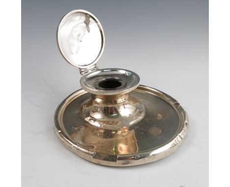 A silver capstan inkwell, of circular form, engraved FR June 24th 1934, af, Birmingham 1931, diameter 8ins