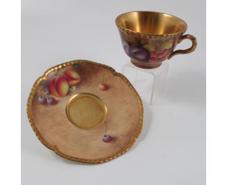 A Royal Worcester tea cup and saucer, decorated with hand painted fruit by Leaman and Roberts Condition report: Good conditio